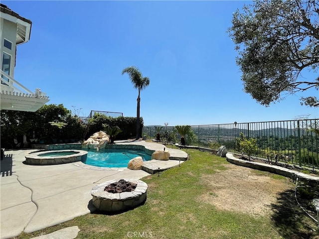 view of swimming pool featuring a fenced backyard, a patio area, an outdoor fire pit, and a pool with connected hot tub