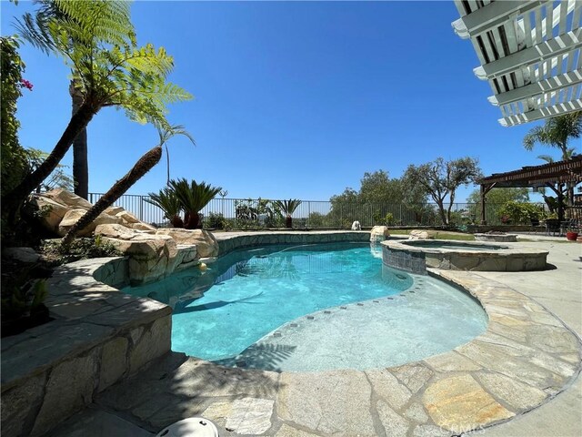 21062 Quail Run Dr, Diamond Bar, CA 91789 - view of pool with a pool with connected hot tub, a fenced backyard, a pergola, and a patio area