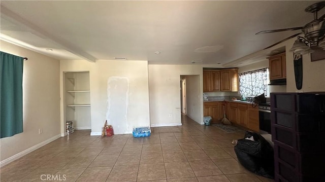 10108 Klingerman St, South El Monte, CA 91733 - kitchen with light tile patterned flooring, baseboards, ceiling fan, and a sink
