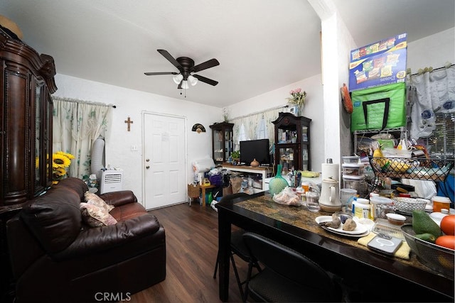 dining space featuring a ceiling fan and dark wood-style floors