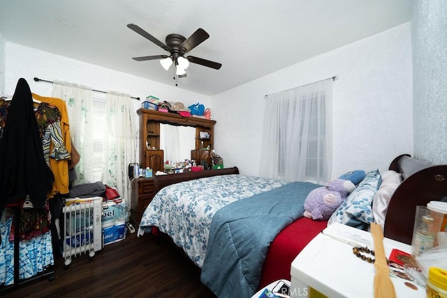 bedroom featuring wood finished floors and a ceiling fan