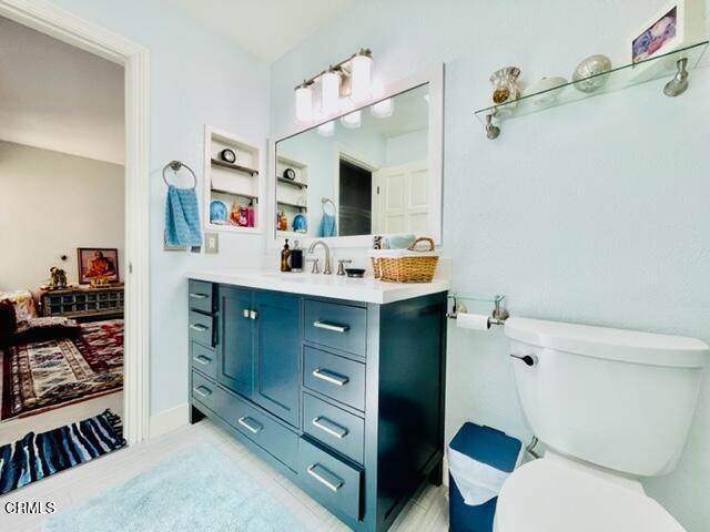 bathroom featuring vanity and toilet