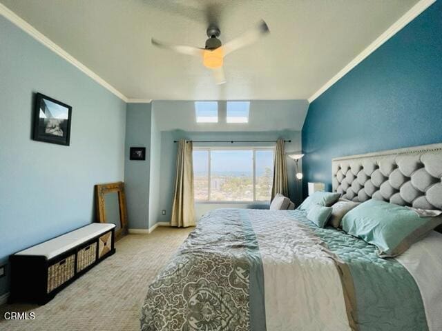 bedroom with carpet floors, crown molding, baseboards, and ceiling fan