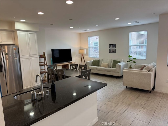 8823 Jacaranda Unit F, Montclair, CA 91763 - living room with plenty of natural light, recessed lighting, and baseboards