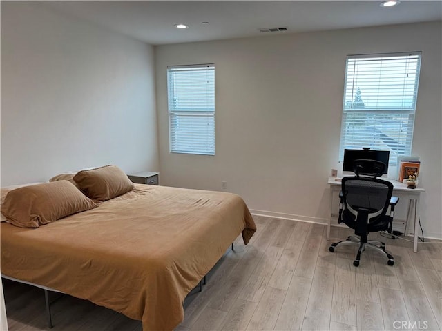 8823 Jacaranda Unit F, Montclair, CA 91763 - bedroom featuring light wood finished floors, an office area, recessed lighting, and baseboards