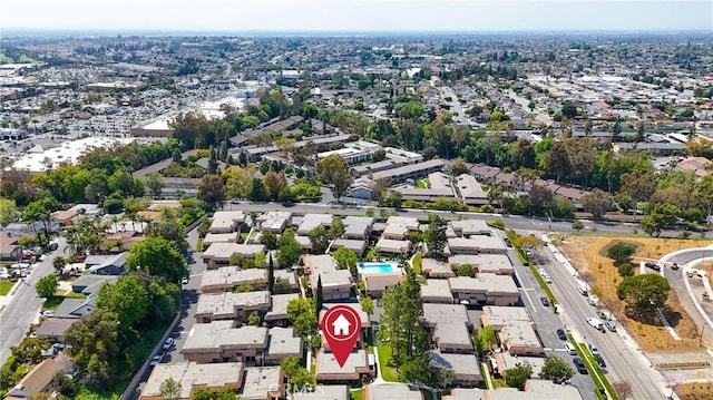 birds eye view of property with a residential view