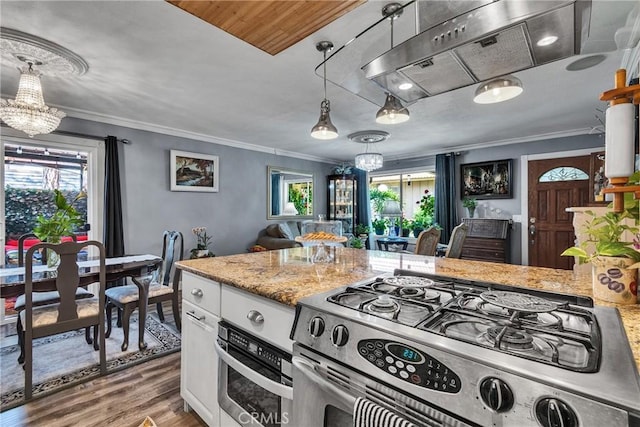 kitchen featuring stainless steel appliances, a chandelier, and plenty of natural light