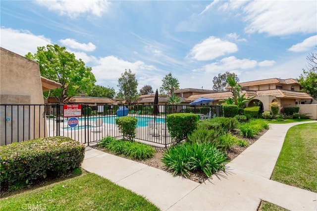 community pool featuring fence