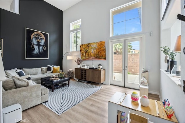 372 W Linden Dr, Orange, CA 92865 - living room with french doors, wood finished floors, and a towering ceiling