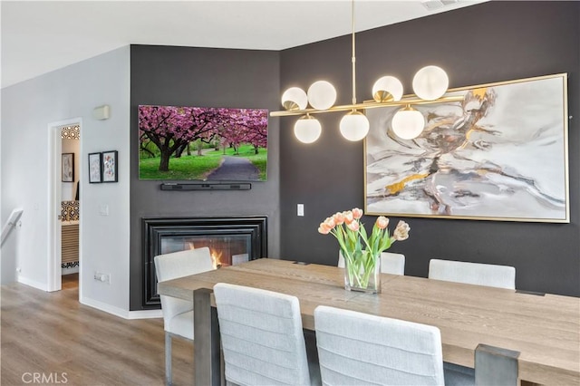 372 W Linden Dr, Orange, CA 92865 - dining space with wood finished floors, baseboards, and a glass covered fireplace