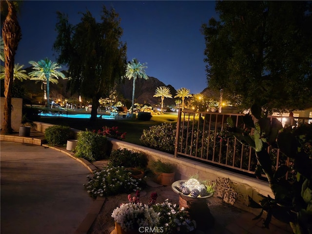 48143 Calle Seranas Ln, Quinta, CA 92253 - patio at twilight featuring an outdoor pool