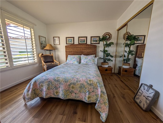 48143 Calle Seranas Ln, Quinta, CA 92253 - bedroom featuring baseboards, multiple windows, and wood finished floors