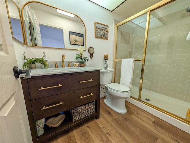 48143 Calle Seranas Ln, Quinta, CA 92253 - full bath with a shower stall, wood finished floors, toilet, and vanity