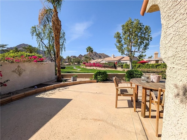 48143 Calle Seranas Ln, Quinta, CA 92253 - view of patio with outdoor dining area and a residential view
