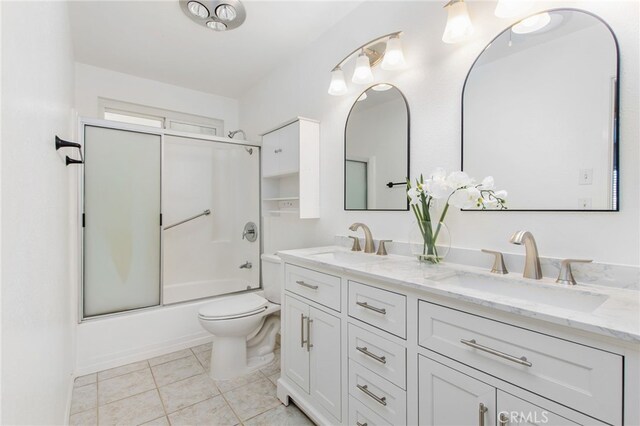 26481 Jamestown Dr, Menifee, CA 92586 - full bath featuring double vanity, shower / bath combination with glass door, and tile patterned floors