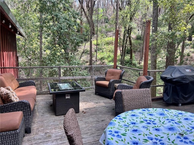 15 Toyon Trl, Berry Creek, CA 95916 - wooden terrace with area for grilling, an outdoor hangout area, a wooded view, and outdoor dining area