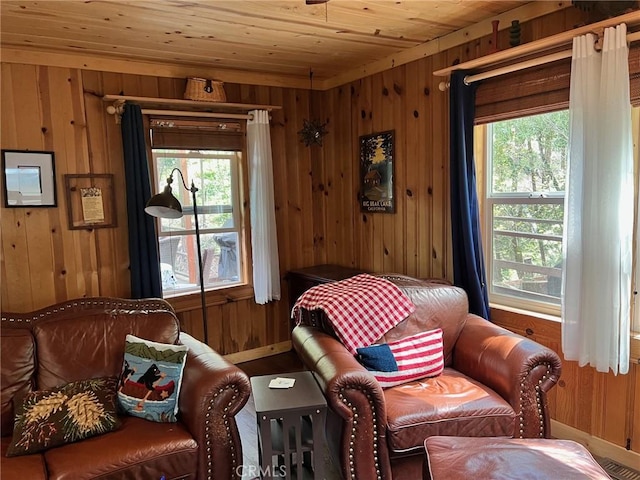 15 Toyon Trl, Berry Creek, CA 95916 - living area with wood walls, baseboards, plenty of natural light, and wooden ceiling