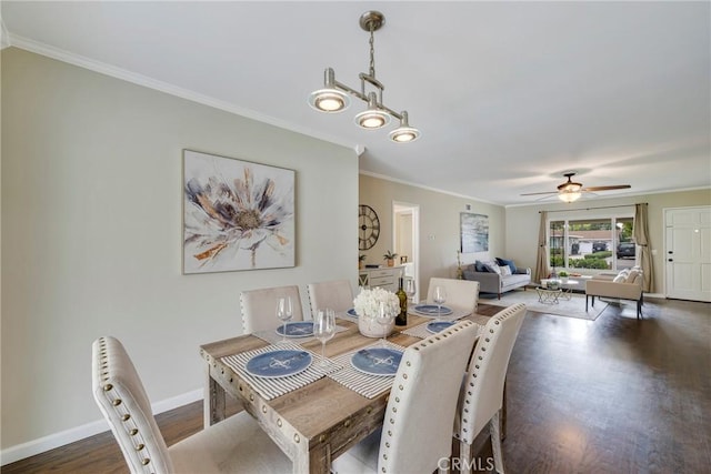 dining room with wood finished floors, ceiling fan, and crown molding