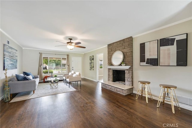living area featuring a ceiling fan, crown molding, and wood finished floors
