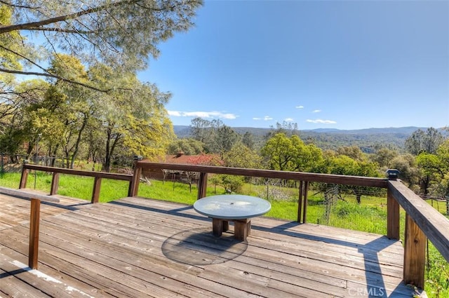 deck featuring a forest view