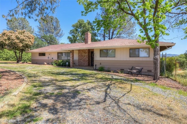 ranch-style home featuring crawl space and a chimney