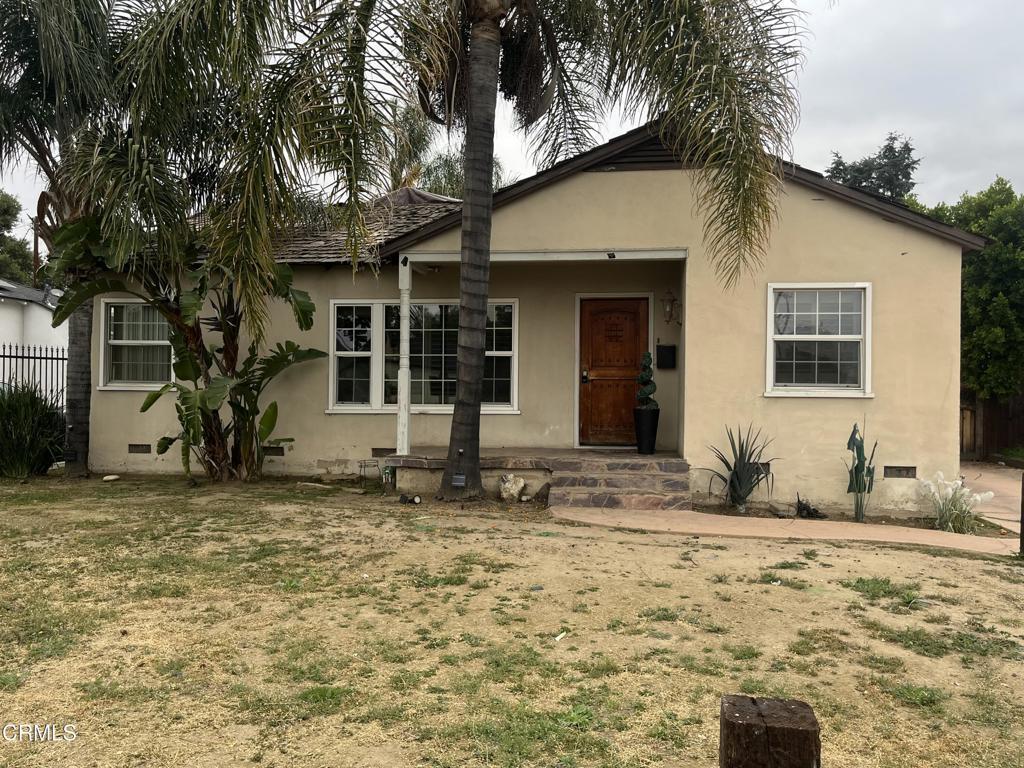 6862 Encino Ave, Van Nuys, CA 91406 - view of front of home featuring fence, crawl space, and stucco siding