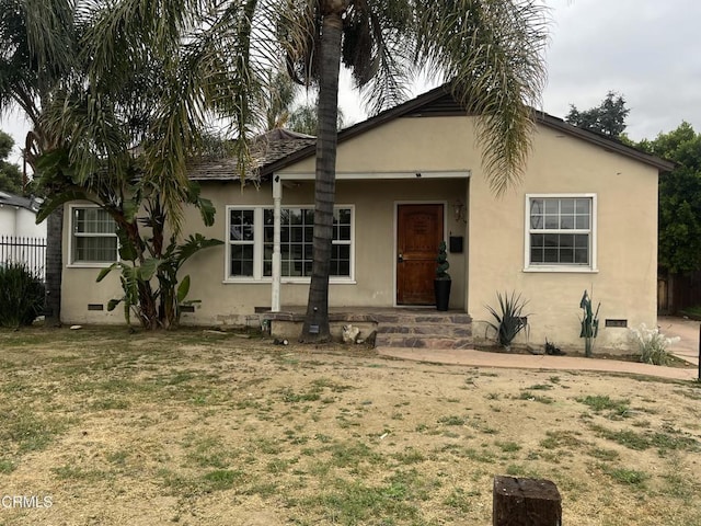 6862 Encino Ave, Van Nuys, CA 91406 - view of front of home featuring fence, crawl space, and stucco siding