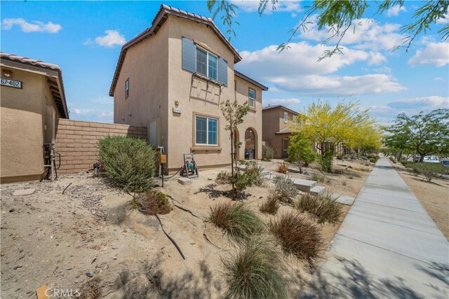 67410 Rio Vista Dr, Cathedral City, CA 92234 - back of house with stucco siding and fence