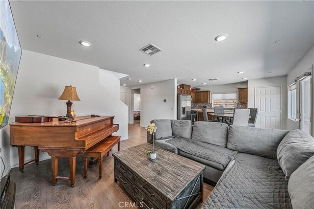 67410 Rio Vista Dr, Cathedral City, CA 92234 - living room with wood finished floors, recessed lighting, and baseboards