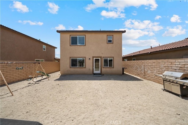 67410 Rio Vista Dr, Cathedral City, CA 92234 - back of property featuring a fenced backyard and stucco siding