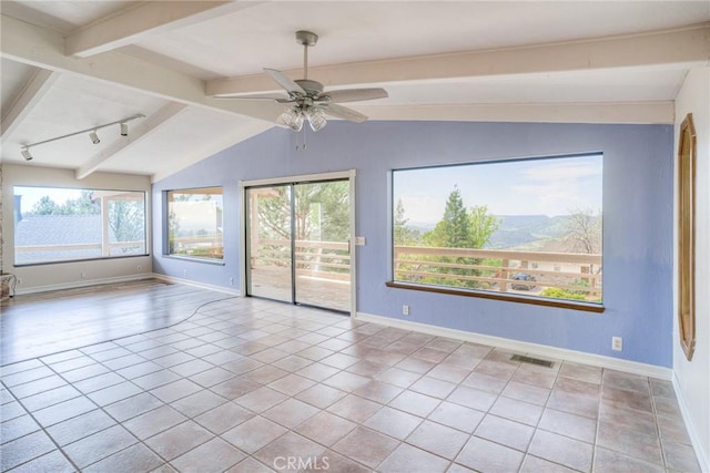 tiled spare room featuring lofted ceiling with beams, baseboards, visible vents, a ceiling fan, and track lighting