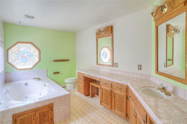 bathroom with a whirlpool tub, visible vents, toilet, and vanity