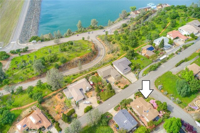 drone / aerial view with a residential view and a water view