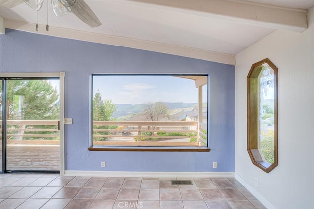 interior space featuring tile patterned floors, vaulted ceiling with beams, visible vents, baseboards, and a ceiling fan