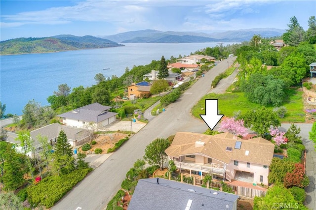 bird's eye view with a residential view and a water and mountain view