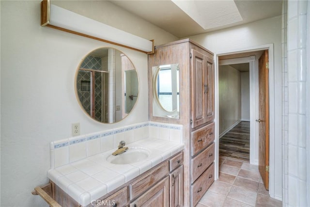 bathroom with tile patterned flooring and vanity