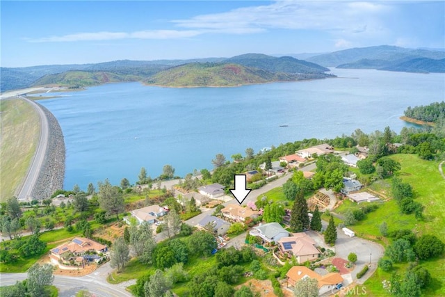 bird's eye view featuring a water and mountain view and a residential view