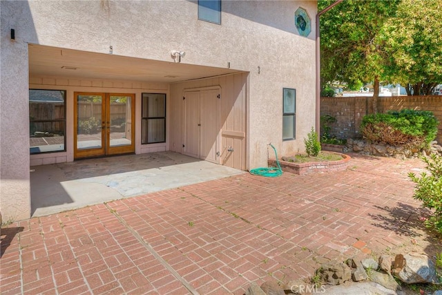 view of patio / terrace with fence and french doors