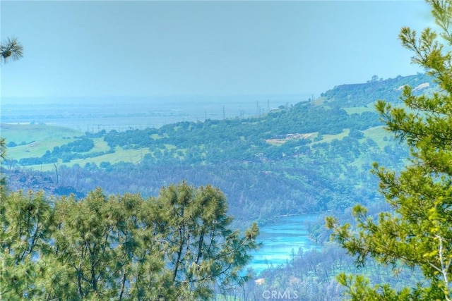 view of mountain feature with a water view