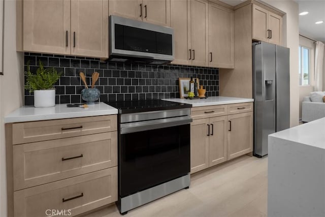152 Balsawood, Tustin, CA 92780 - kitchen featuring light wood-type flooring, stainless steel appliances, recessed lighting, and backsplash