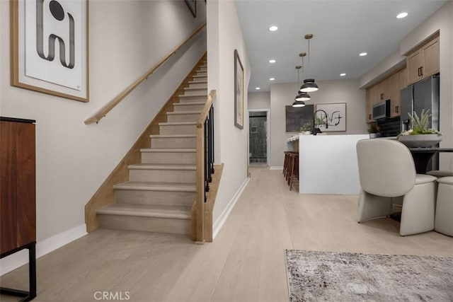 152 Balsawood, Tustin, CA 92780 - staircase with baseboards, wood finished floors, and recessed lighting