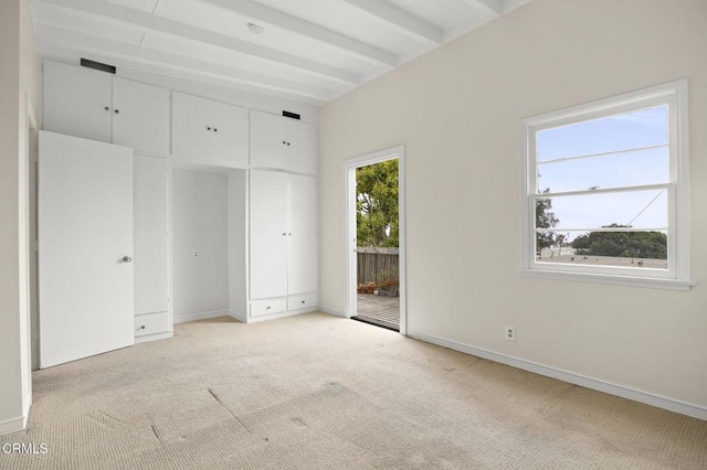 unfurnished bedroom with baseboards and light colored carpet