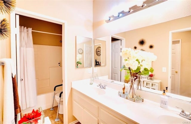 full bathroom with shower / bath combination with curtain, toilet, a sink, and double vanity