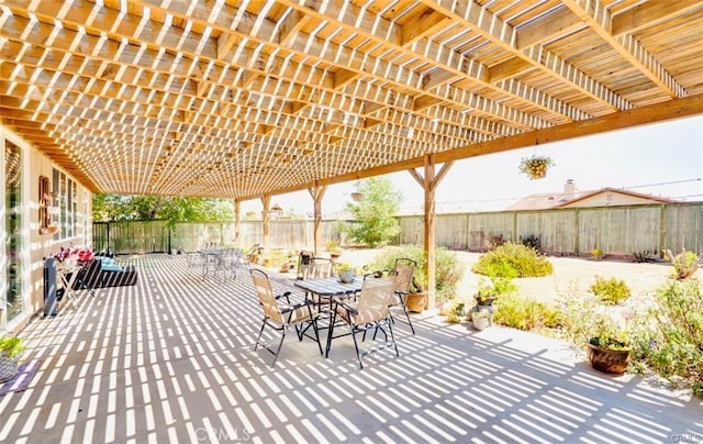 view of patio / terrace with a pergola, a fenced backyard, and outdoor dining area