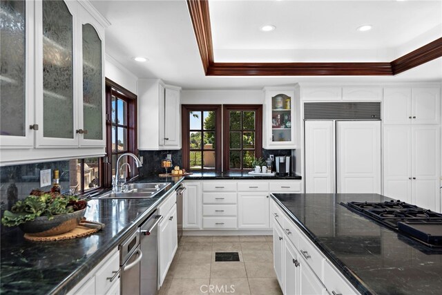 6 Riverstone, Laguna Niguel, CA 92677 - kitchen with light tile patterned flooring, decorative backsplash, paneled built in refrigerator, and a sink