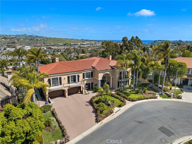 6 Riverstone, Laguna Niguel, CA 92677 - mediterranean / spanish house with a tile roof, a chimney, driveway, an attached garage, and stucco siding