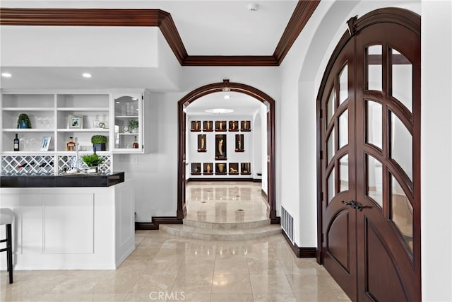 6 Riverstone, Laguna Niguel, CA 92677 - entryway with a dry bar, french doors, visible vents, baseboards, and ornamental molding