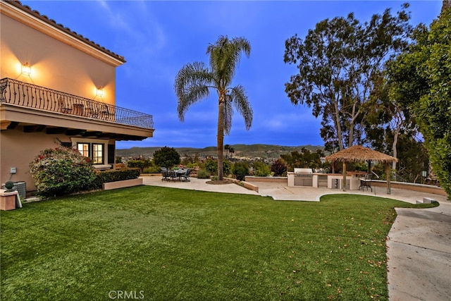 6 Riverstone, Laguna Niguel, CA 92677 - view of yard with central AC, a balcony, exterior kitchen, and a patio