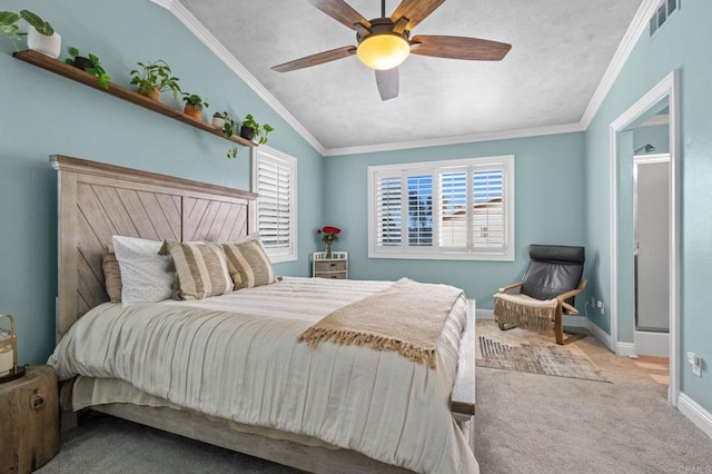 bedroom with vaulted ceiling, baseboards, ornamental molding, carpet flooring, and visible vents