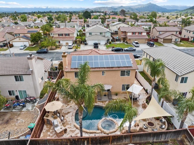 birds eye view of property with a mountain view and a residential view